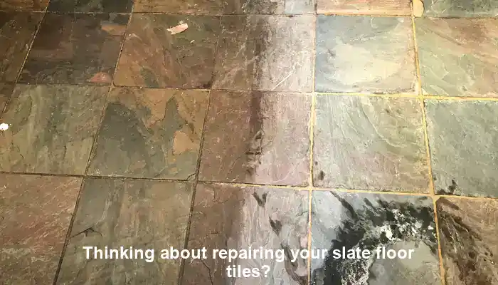 Cracked slate floor tiles requiring repair suitability assessment