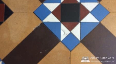 Victorian hallway floor during restoration with deep contamination being removed