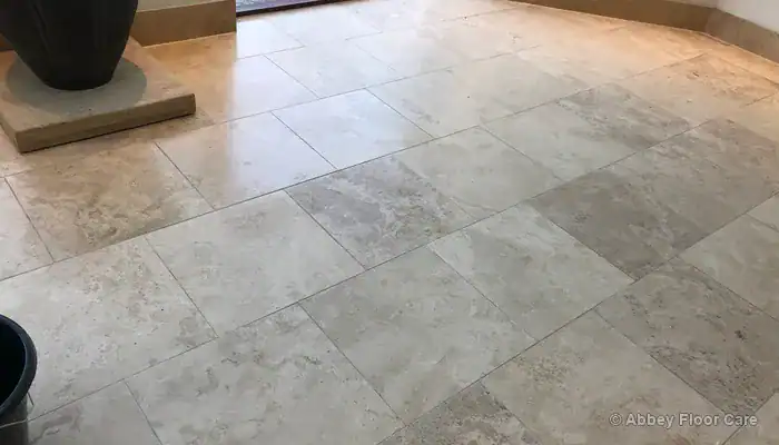 Travertine floor after professional cleaning, honing, filling and sealing showing even satin finish